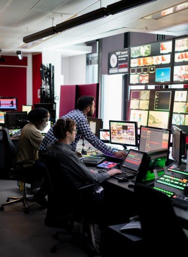 man in black and white checkered dress shirt sitting on black office rolling chair